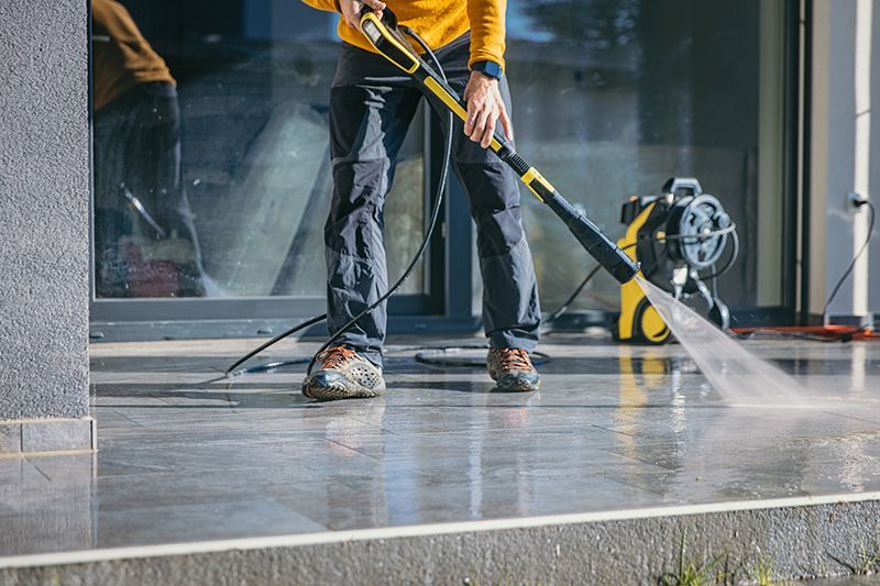 Large industrial warehouse floor being cleaned