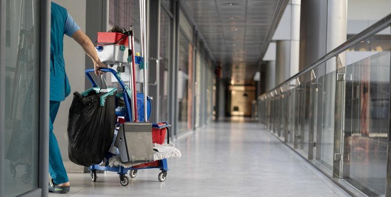 Cleaner servicing a condominium lobby and corridor
